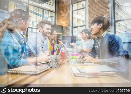 Group Of Asian and Multiethnic Business people with casual suit working and talking together in the modern Office
