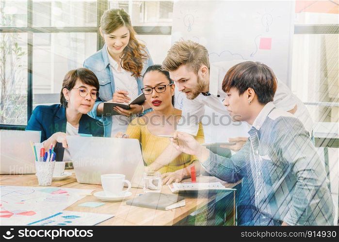 Group Of Asian and Multiethnic Business people with casual suit working and brainstorming together with technology computer in the modern Office, people business group concept
