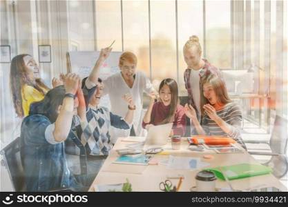 Group Of Asian and Multiethnic Business people with casual suit working and brainstorming together with technology computer in the modern Office, people business group and entrepreneurship concept.