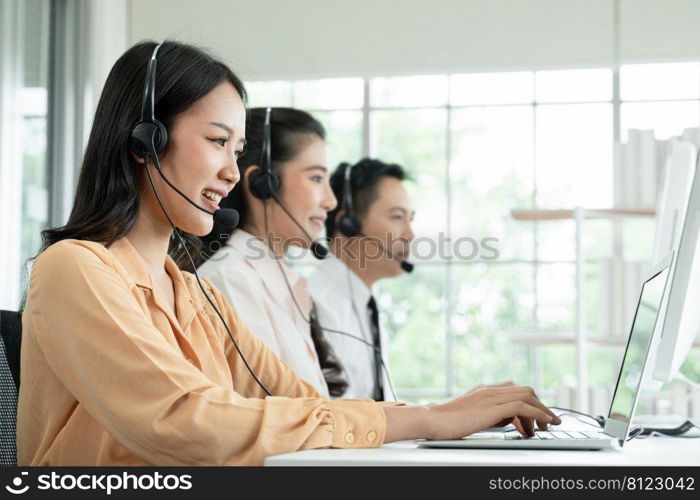 Group of Asian employee work in telemarketing customer service teams. Young operator woman working with headset smiling and doing customer support at work. Call Center with service mind concept