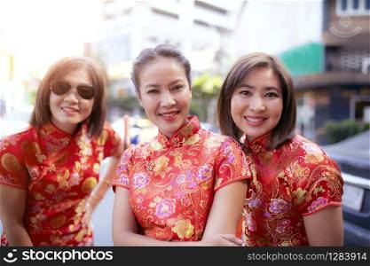 group of asian woman wearing chinese tradition clothes toothy smiling face happiness emotion