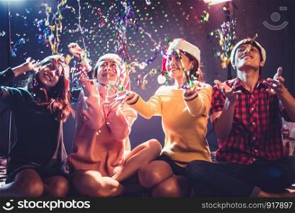 Group of Asian young peoples who celebrating Christmas and New Year. Holiday and Happiness concept. Friendship and Relax theme.