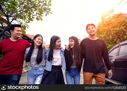 group of asian younger man and woman relaxing toothy smiling face with happiness emotion