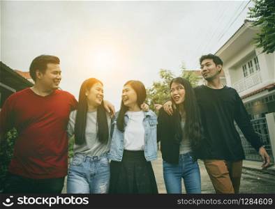 group of asian younger man and woman relaxing toothy smiling face with happiness emotion