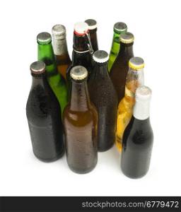 Group of Beer bottles isolated studio shot. Green and brown bottles