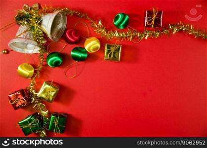 group of bell, ball and gift in christmas on red background on top view