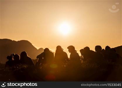 Group of Boy Scouts at sunset in the mountains