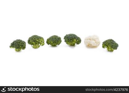 Group of broccoli and one cauliflower between them