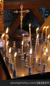 Group of burning candles in Ukrainian orthodox church
