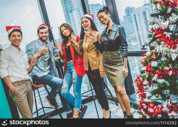 Group of business diversity colleague teamwork celebaring for New Year party in modern urban office background. Friends having enjoy party with alcoholivd drink together. Multi ethics people lifestyle