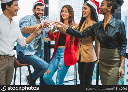 Group of business diversity colleague teamwork celebaring for New Year party in modern urban office background. Friends having enjoy party with alcoholivd drink together. Multi ethics people lifestyle