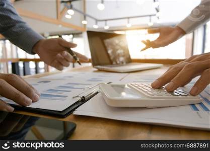 group of Business executives analysis data document and calculating about fee tax at a office