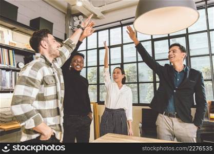 group of business office employee mix race cheerful glad raising hand together for successful finish project done concept