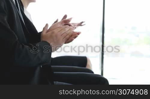 Group of business people applauding at conference