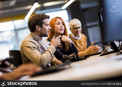 Group of business people are working together on a computer