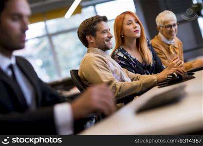 Group of business people are working together on a computer