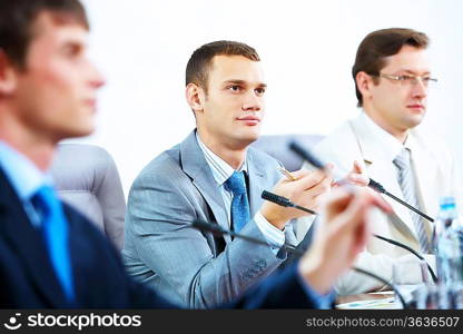 Group of business people at conference hall at the start of the conference meeting