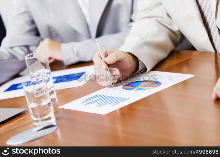 Group of business people brainstorming together in the meeting room