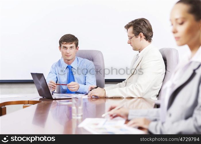 Group of business people brainstorming together in the meeting room. Business team meeting