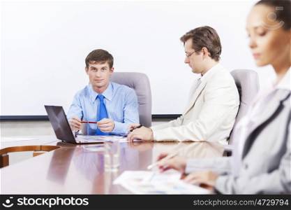 Group of business people brainstorming together in the meeting room. Business team meeting