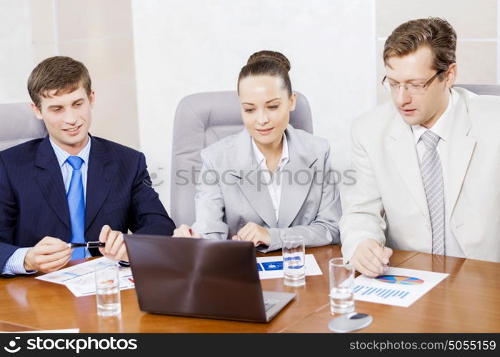 Group of business people brainstorming together in the meeting room. Business team meeting