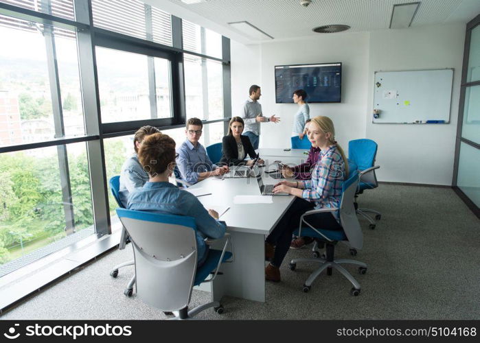 Group of business people discussing business plan in the office