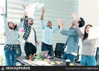 Group of business people finish job done throwing paper work and dance with happiness. Diversity people dance, fun, joy, happy promotion  employment having good news. Man look at camera dancing happy