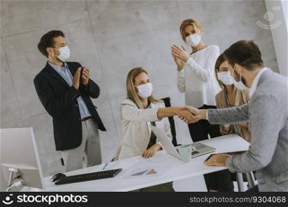 Group of business people have a meeting and working in the office and wear masks as protection from corona virus