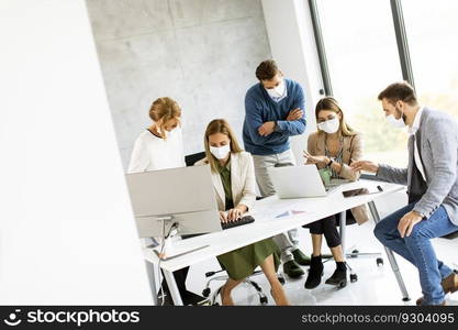 Group of business people have a meeting and working in the office and wear masks as protection from corona virus