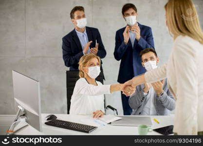 Group of business people have a meeting and working in the office and wear masks as protection from corona virus