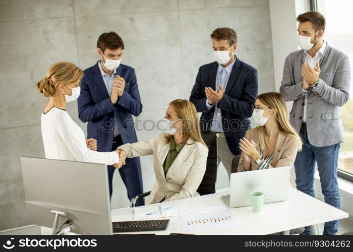 Group of business people have a meeting and working in the office and wear masks as protection from coronavirus