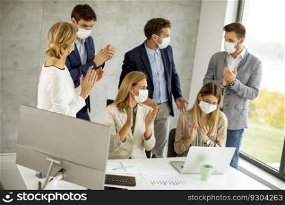 Group of business people have a meeting and working in the office and wear masks as protection from coronavirus