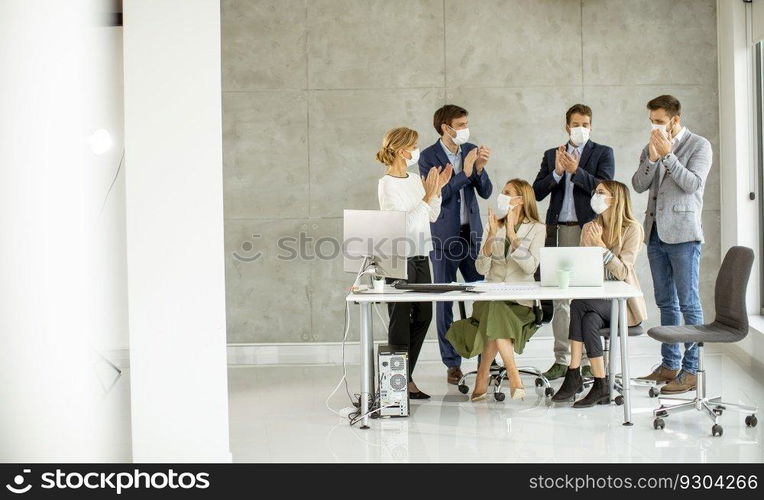 Group of business people have a meeting and working in the office and wear masks as protection from coronavirus