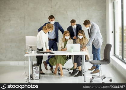 Group of business people have a meeting and working in the office and wear masks as protection from coronavirus