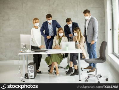 Group of business people have a meeting and working in the office and wear masks as protection from coronavirus