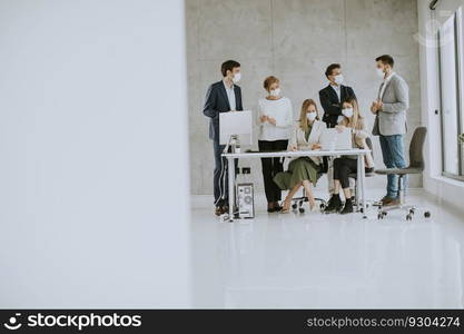 Group of business people have a meeting and working in the office and wear masks as protection from corona virus