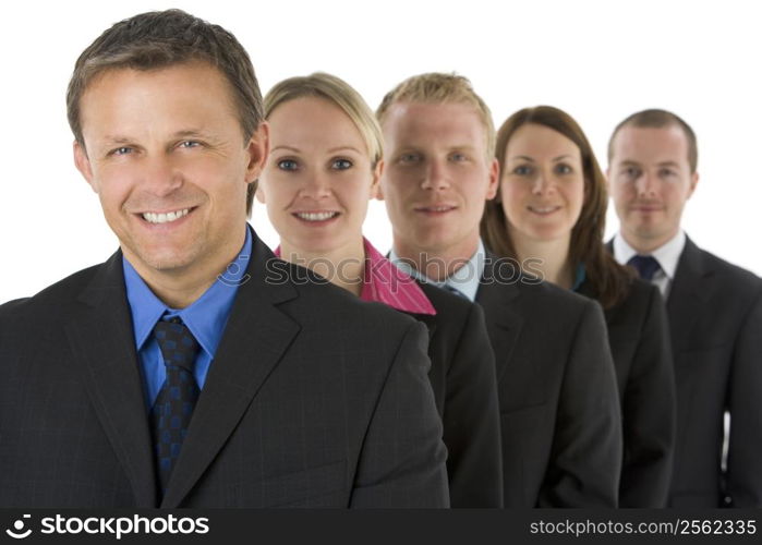 Group Of Business People In A Line Smiling