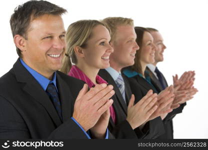 Group Of Business People In A Line Smiling And Applauding