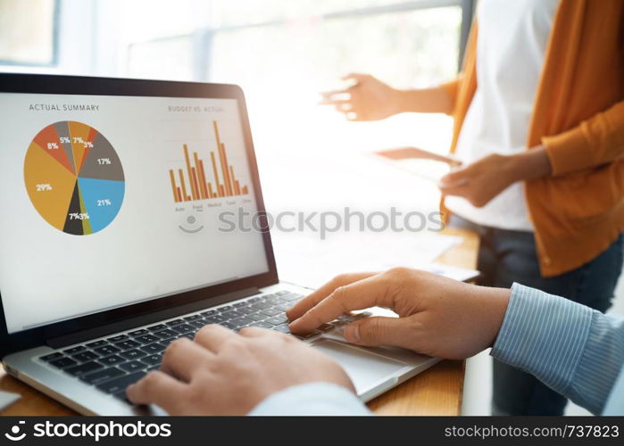 Group of Business people meeting analyzing financial documents in workplace.