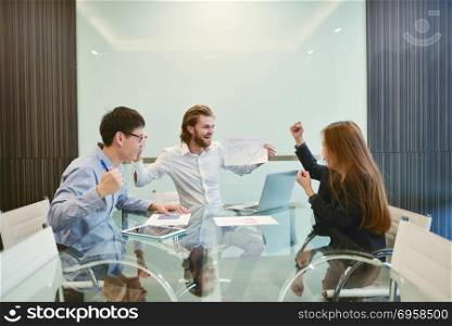 Group of business people meeting in a meeting room, sharing thei. Group of business people meeting in a meeting room, sharing their ideas, Multi ethnic. Group of business people meeting in a meeting room, sharing their ideas, Multi ethnic