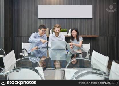 Group of business people meeting in a meeting room, sharing thei. Group of business people meeting in a meeting room, sharing their ideas, Multi ethnic. Group of business people meeting in a meeting room, sharing their ideas, Multi ethnic