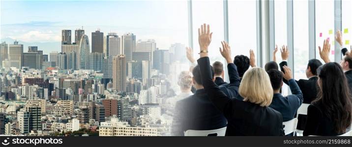 Group of business people meeting in a seminar conference widen view . Audience listening to instructor in employee education training session . Office worker community summit forum with speaker .. Group of business people meeting in a seminar conference widen view