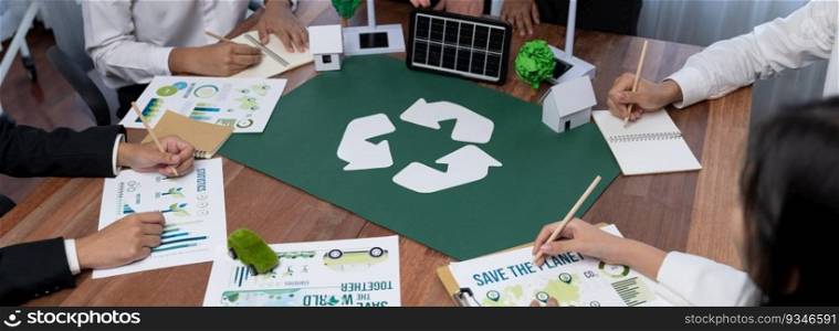 Group of business people planning and discussing on recycle reduce reuse policy symbol in office meeting room. Green business company with eco-friendly waste management regulation concept.Trailblazing. Group of business people planning and discussing on recycle symbol.Trailblazing