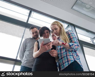 group of business people preparing for next meeting and discussing ideas using digital tablet