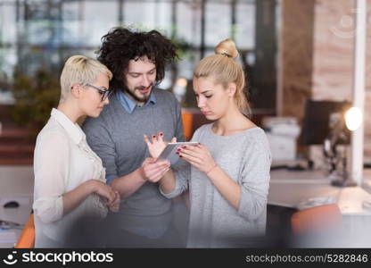 group of business people preparing for next meeting and discussing ideas using digital tablet