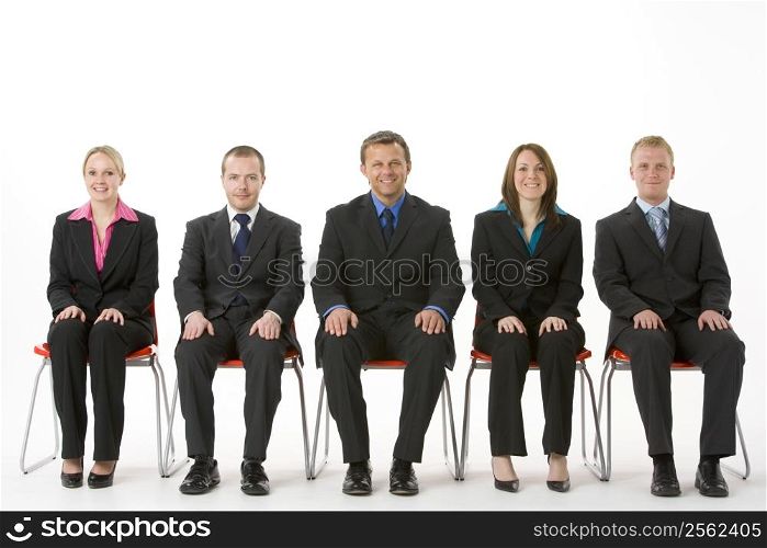 Group Of Business People Sitting In A Line