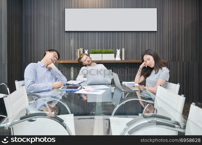 Group of business people sleeping in meeting room with blank pic. Group of business people sleeping in meeting room with blank picture. Group of business people sleeping in meeting room with blank picture