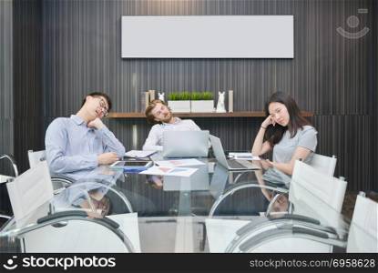 Group of business people sleeping in meeting room with blank pic. Group of business people sleeping in meeting room with blank picture. Group of business people sleeping in meeting room with blank picture