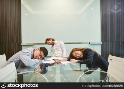 Group of business people sleeping in meeting room with blank pic. Group of business people sleeping in meeting room with blank picture. Group of business people sleeping in meeting room with blank picture