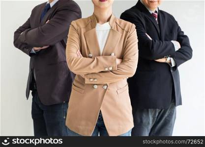 Group of business people with businesswomen leader standing with arms folded on foreground